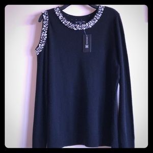 A beautiful black top NWT with beautiful sequins